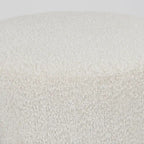 Pouf rotondo in tessuto bouclé color crema con base in metallo nero